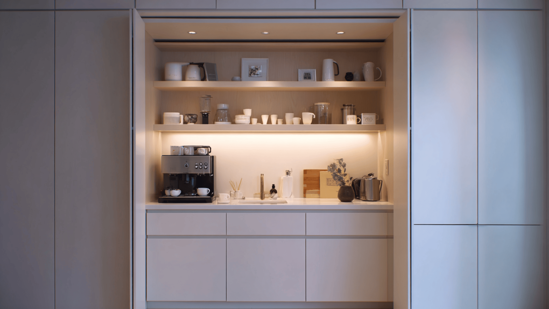 hidden coffee station behind cabinet doors