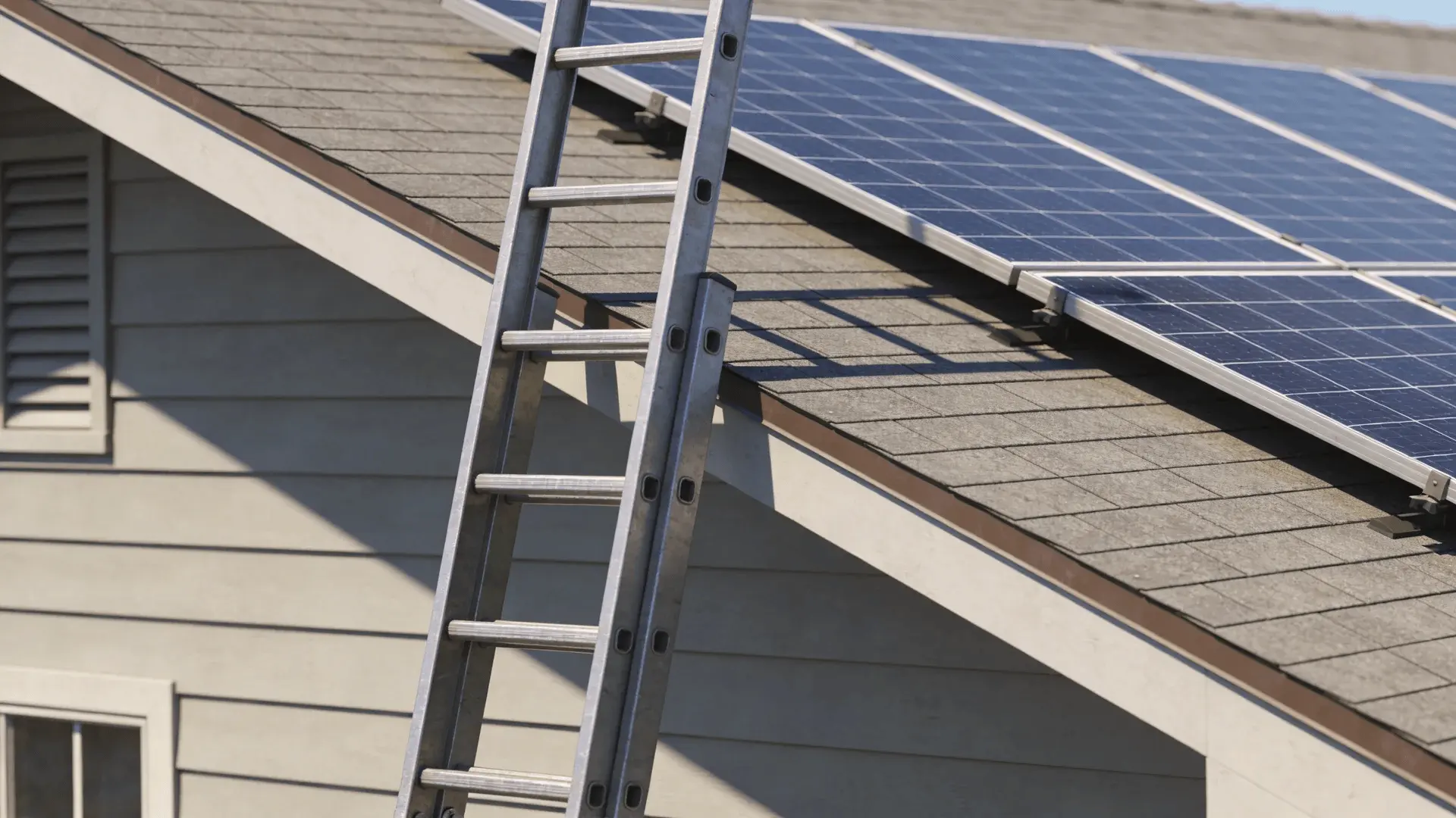 Ladder placed securely beside rooftop solar panels on a house