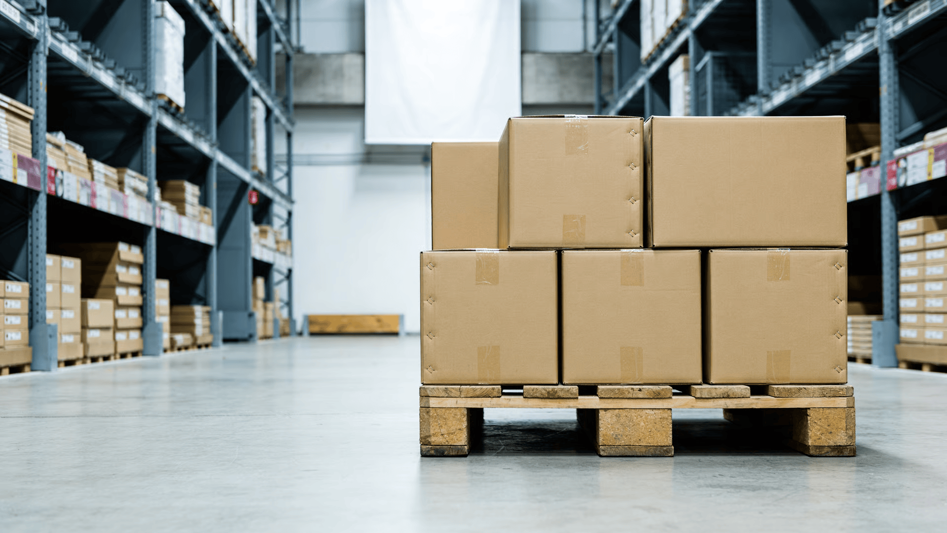 Pallet of sealed shipping boxes in a warehouse storage area