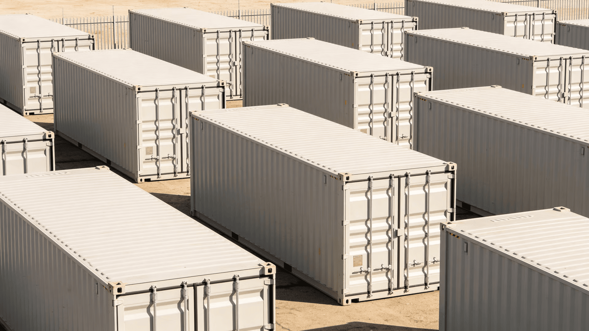 Portable storage containers lined up in an outdoor storage facility
