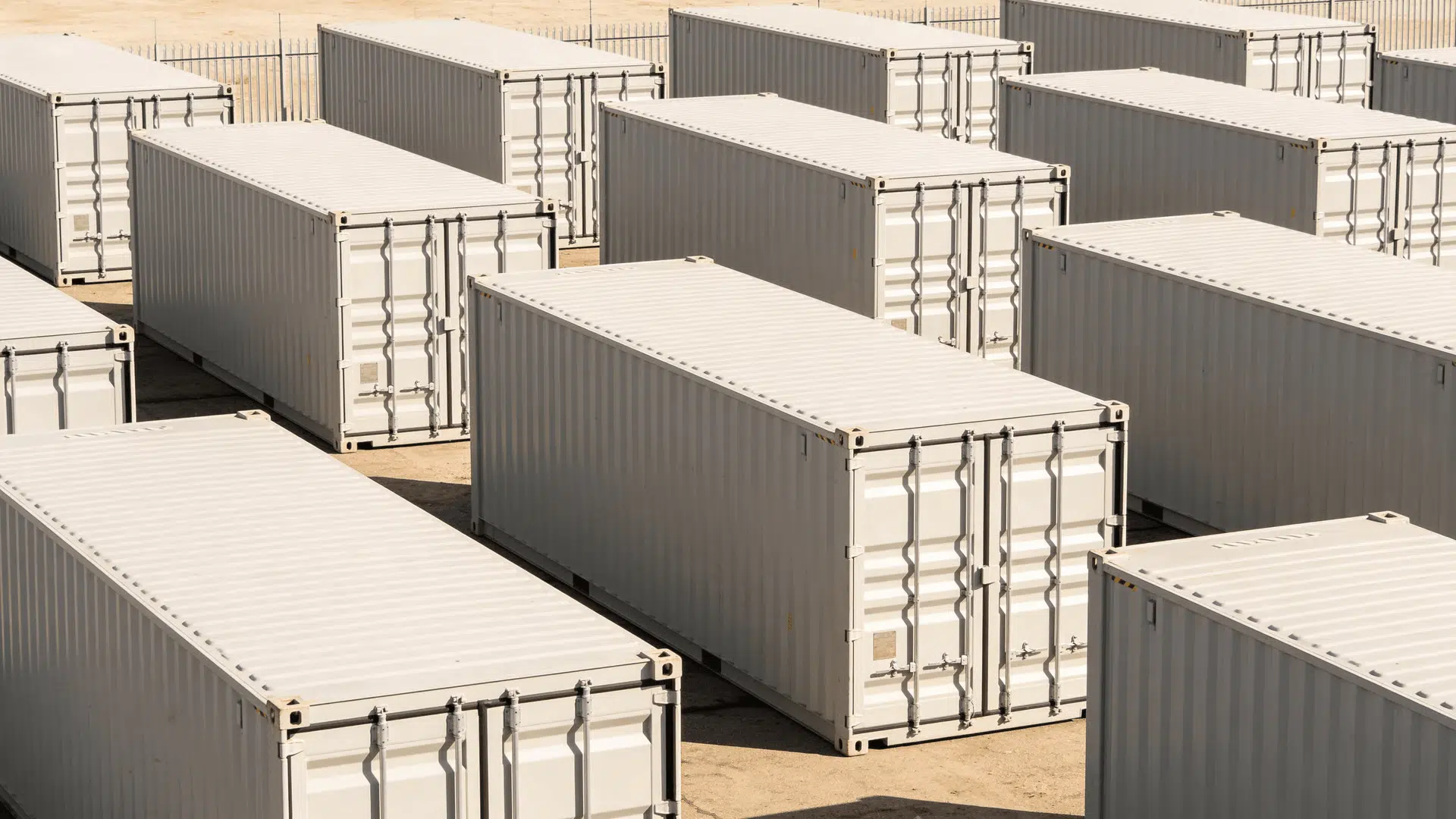 Portable storage containers lined up in an outdoor storage facility