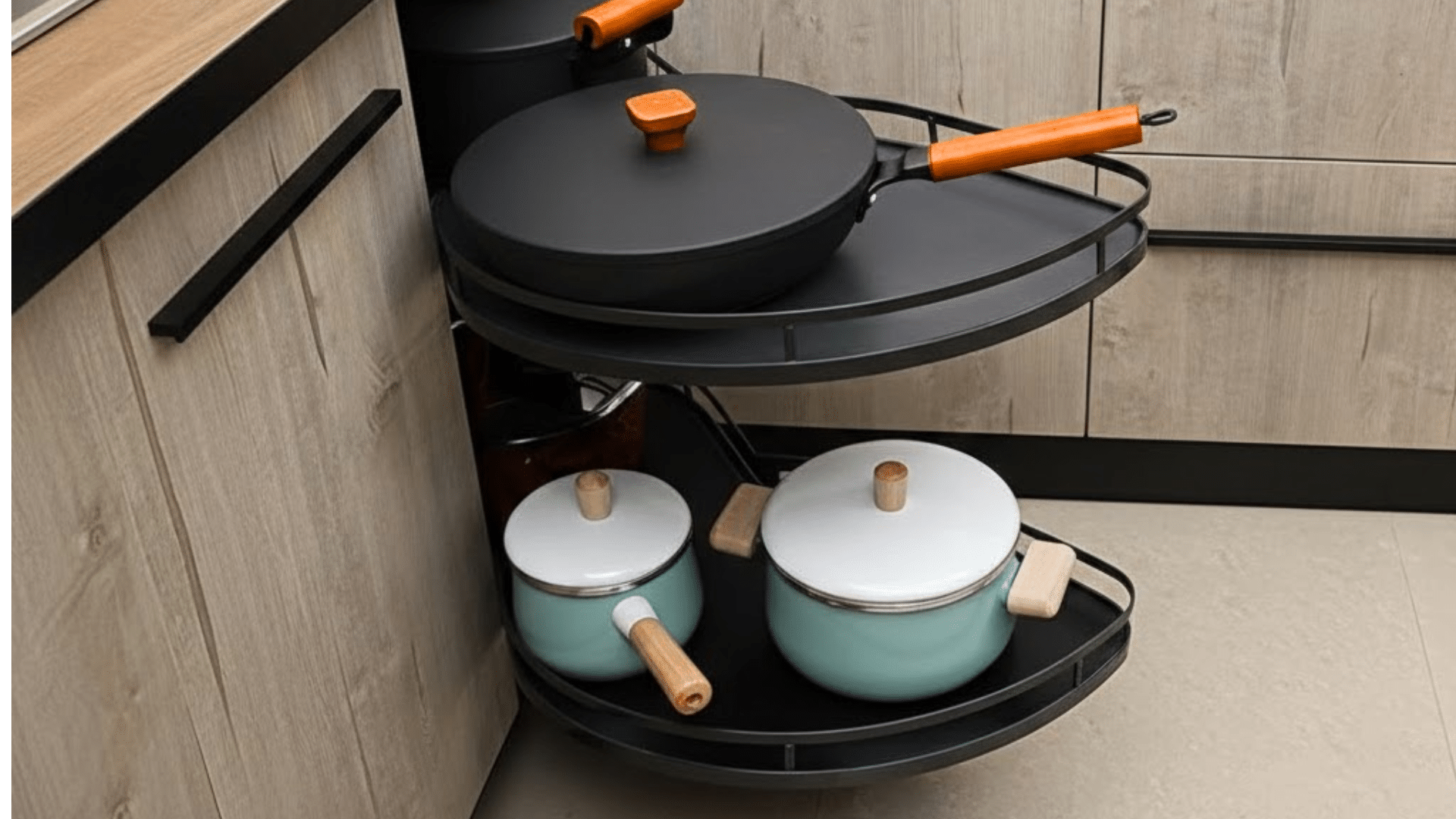 blind corner cabinet with swing out trays holding pots and lids pulled forward for easy access