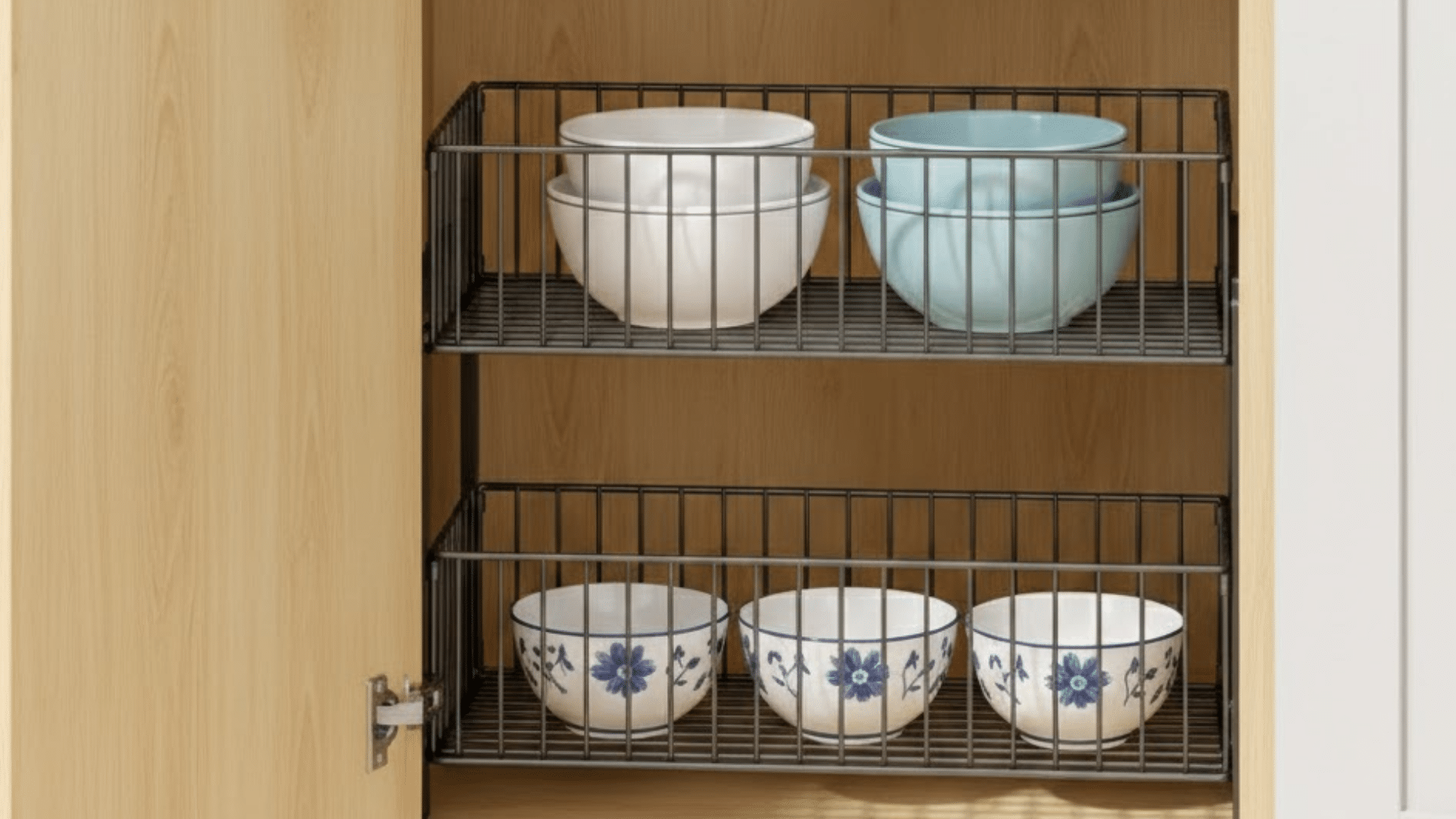 two tier sliding trays extended from corner cabinet holding kitchen items