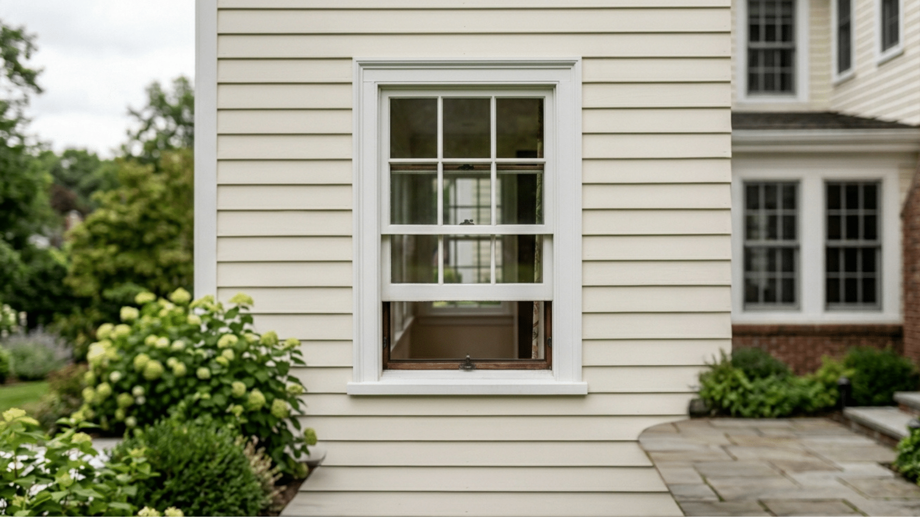 double hung window partially open white frame exterior home siding energy efficient residential window