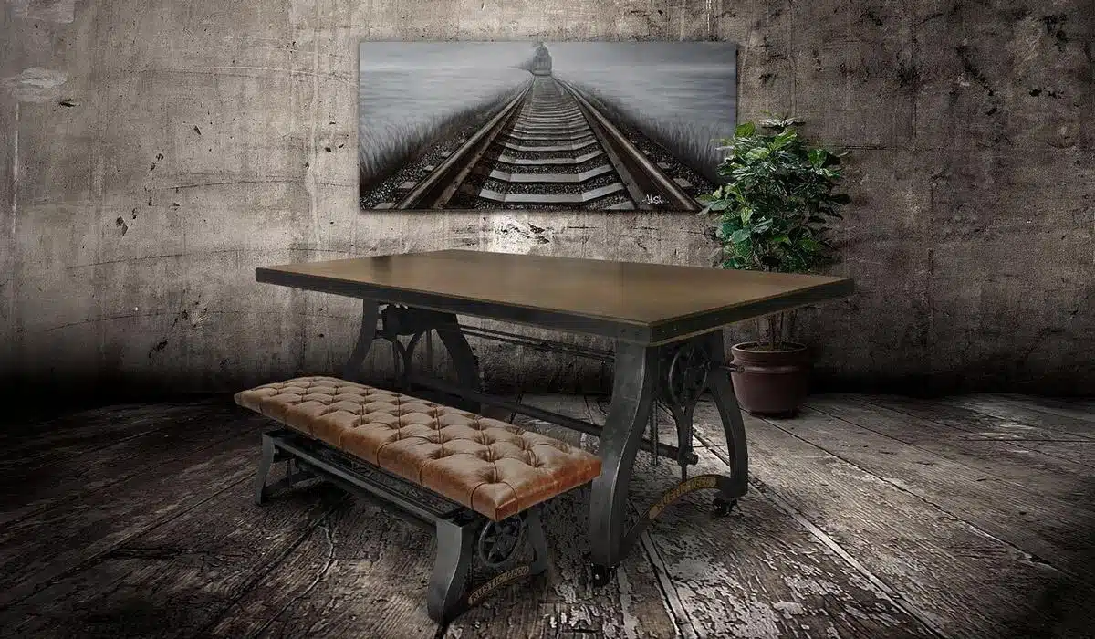 Industrial crank dining table with brown tufted leather bench