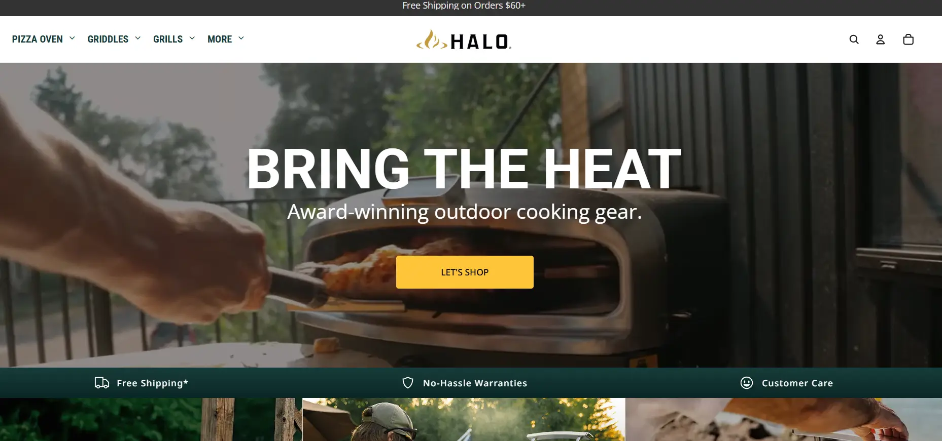 Outdoor pizza oven with person placing pizza in yard setting under natural light