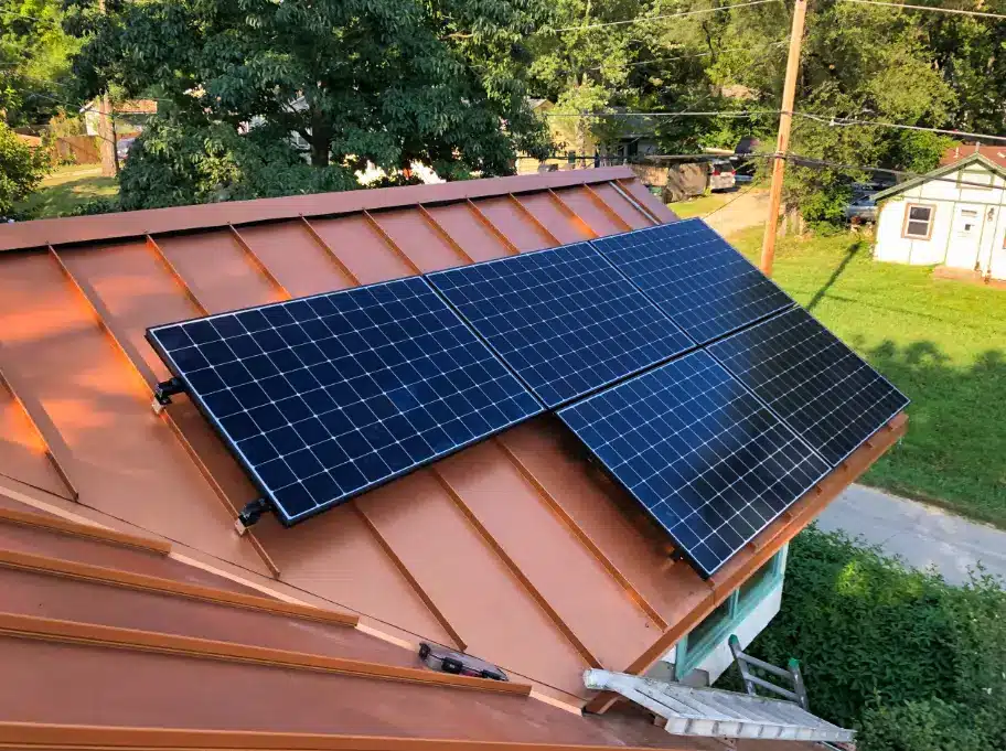 Solar panels installed on a copper roof in a suburban residential area