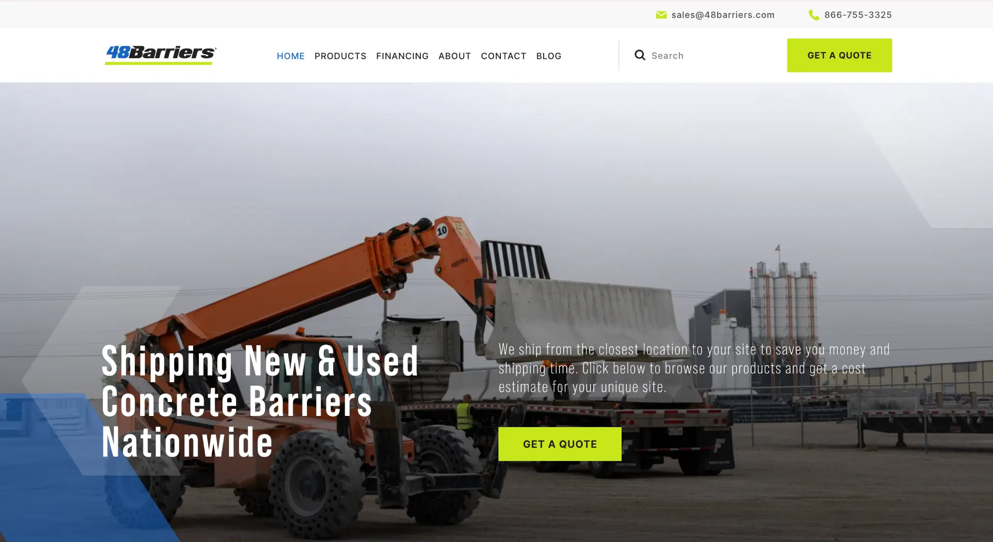 Orange forklift placing concrete barrier on flatbed trailer in industrial outdoor setting