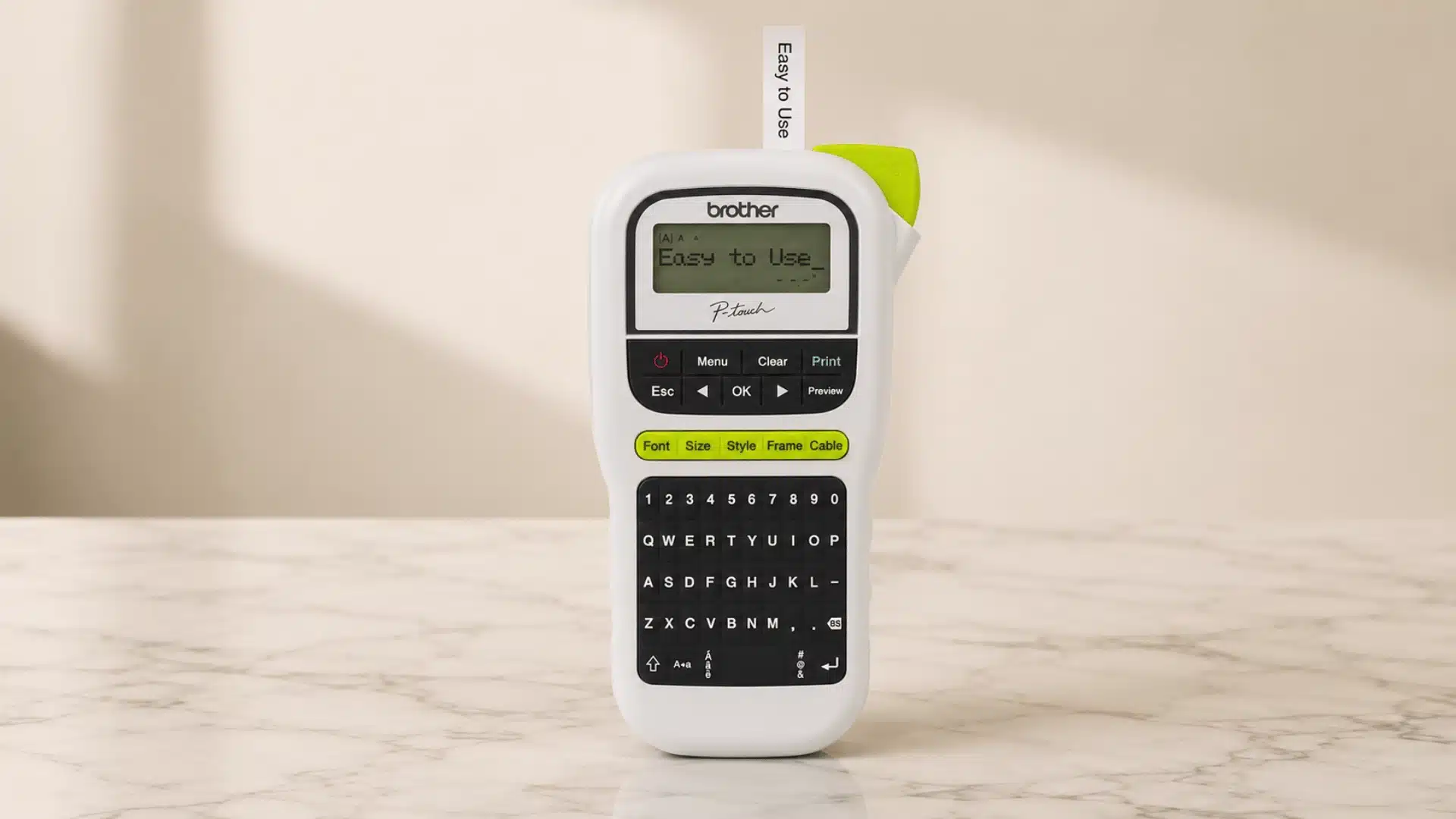 Brother P-touch label maker standing on a marble table with an “Easy to Use” label.