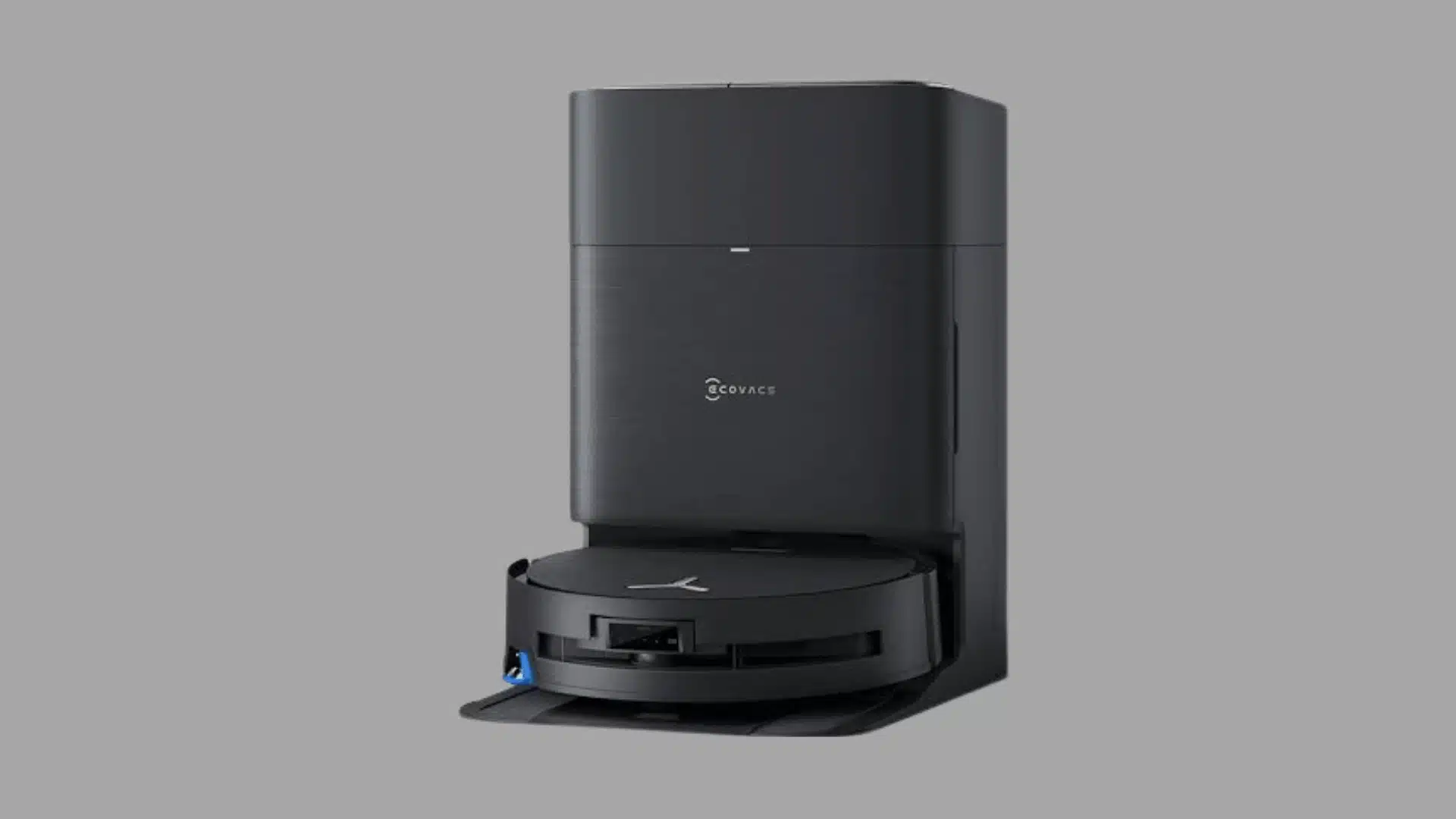 Black robot vacuum with a tall self-emptying dock displayed on a plain white background.