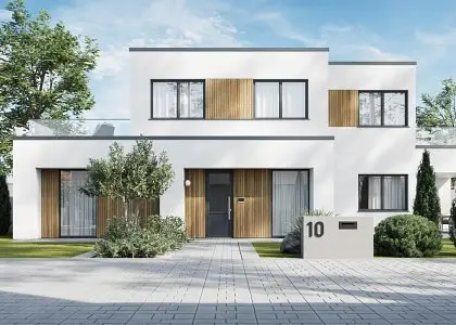 Modern white two-story house with wooden accents and landscaped front garden under blue sky