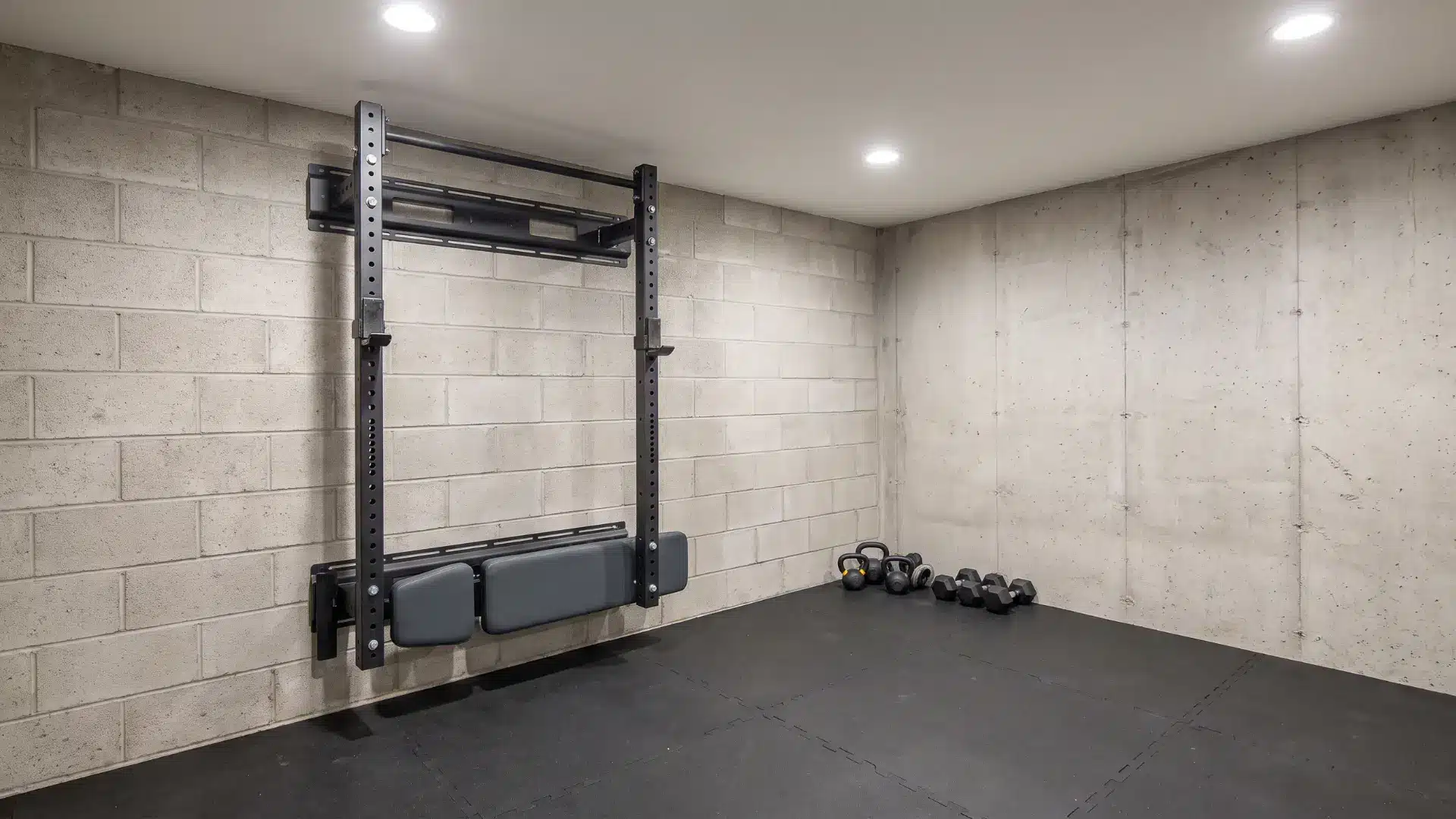 Basement gym with wall rack and foldable bench