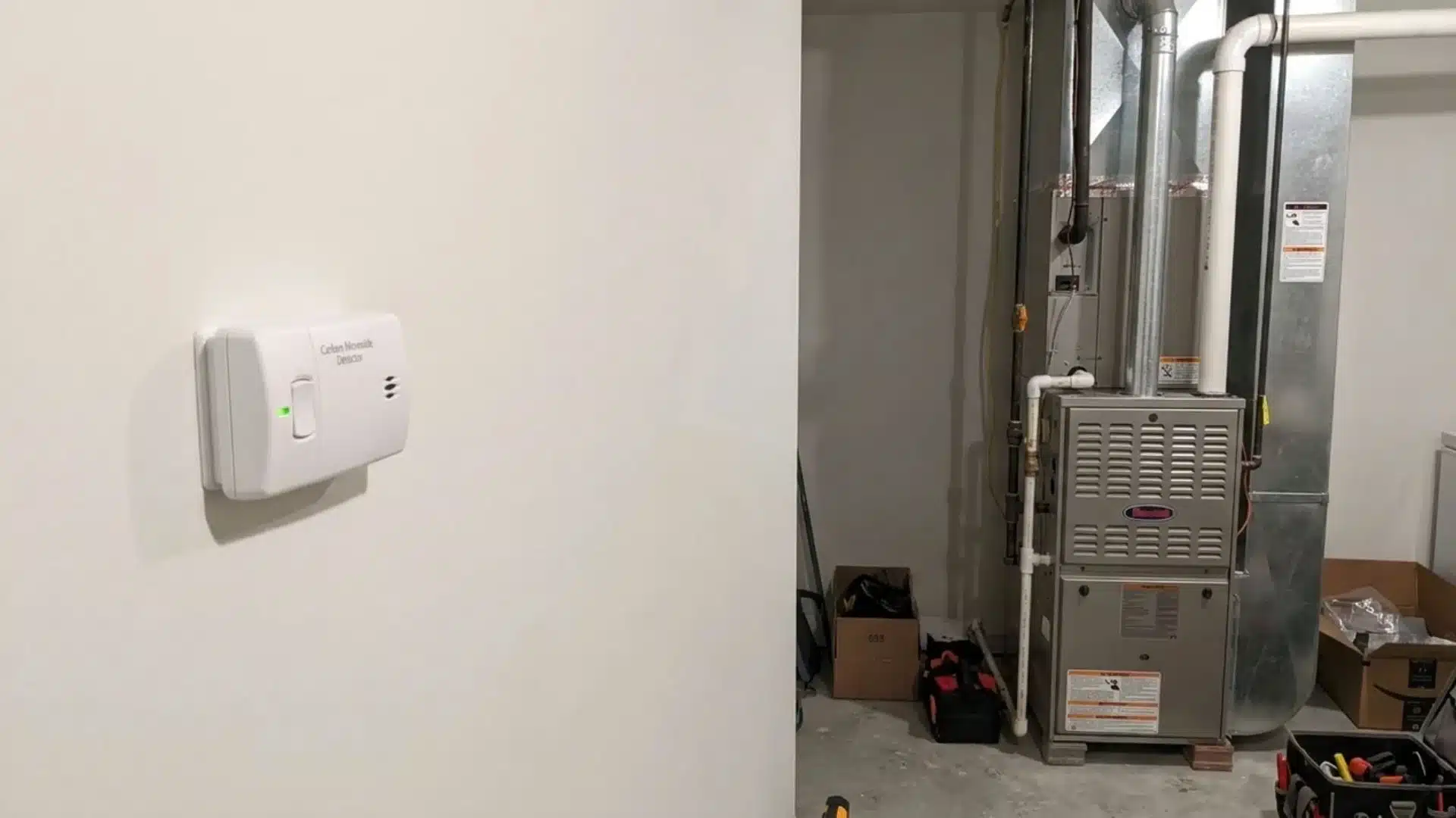 Carbon monoxide detector on a wall near a gas furnace