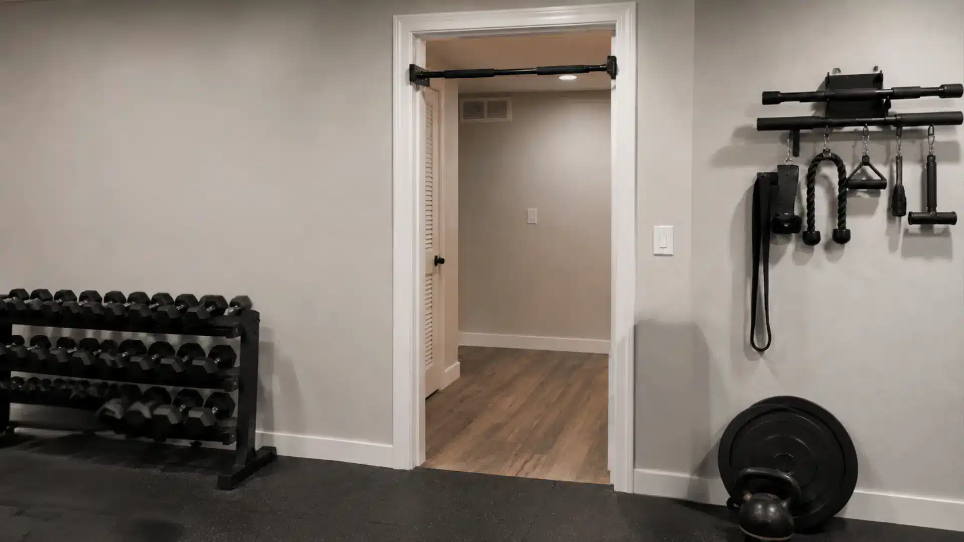 Doorframe pull-up bar installed in a home gym doorway