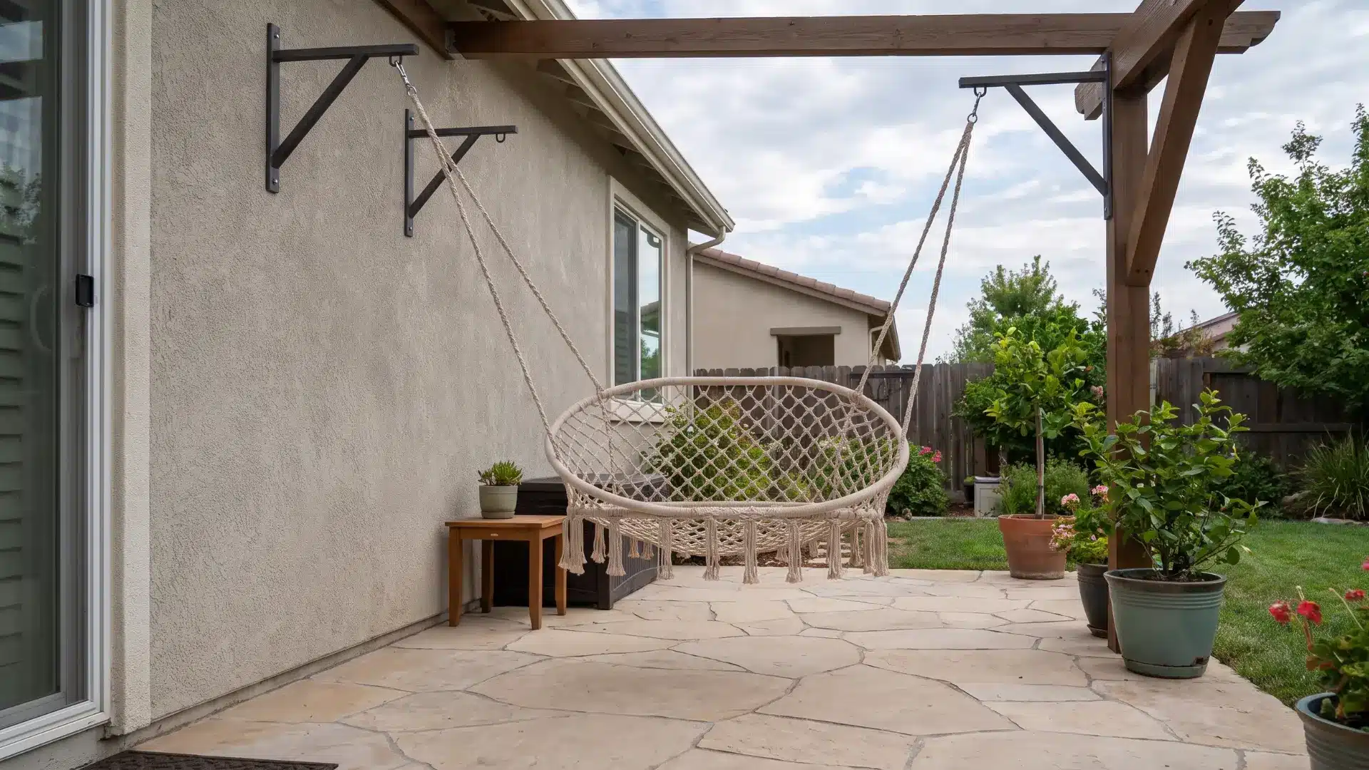 Hanging patio chair suspended above clear floor space from secure supports