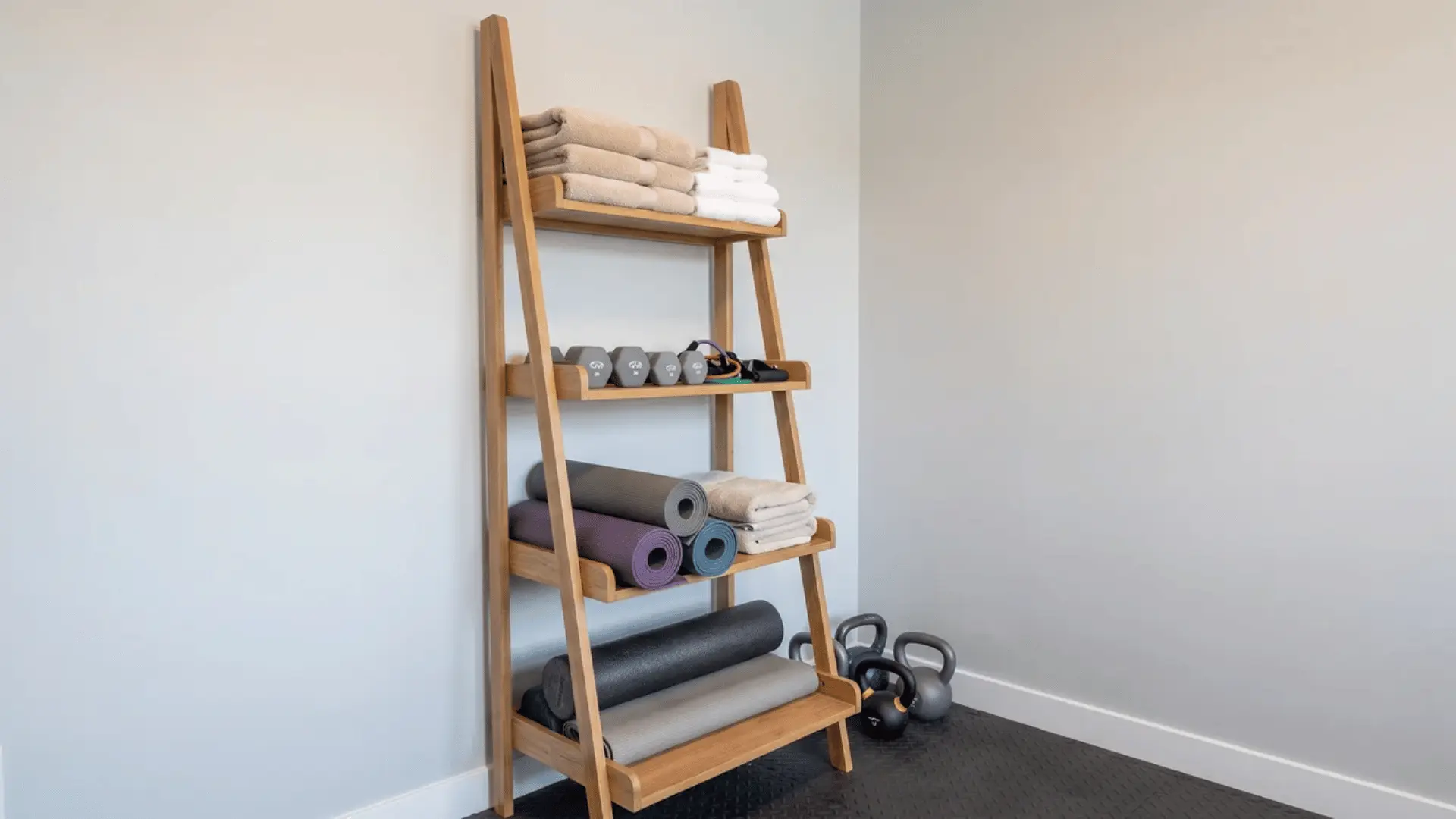 Ladder shelf storing towels mats and small weights