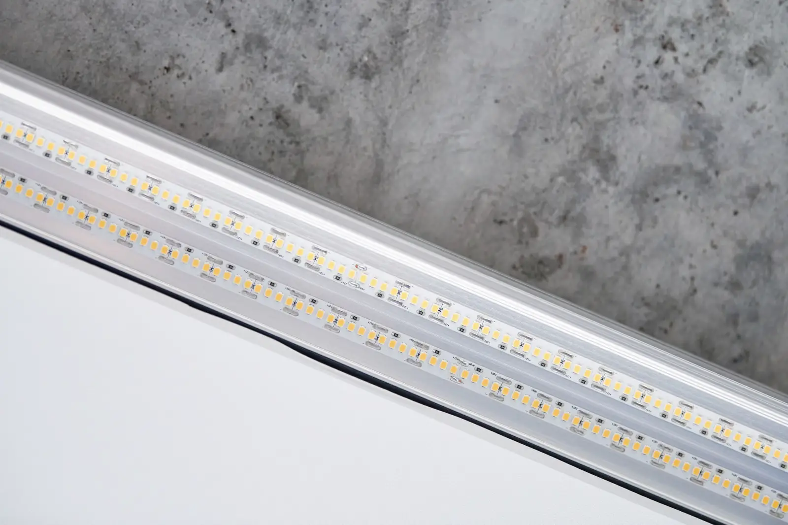 LED strip lights on concrete background, close-up angle with neutral lighting
