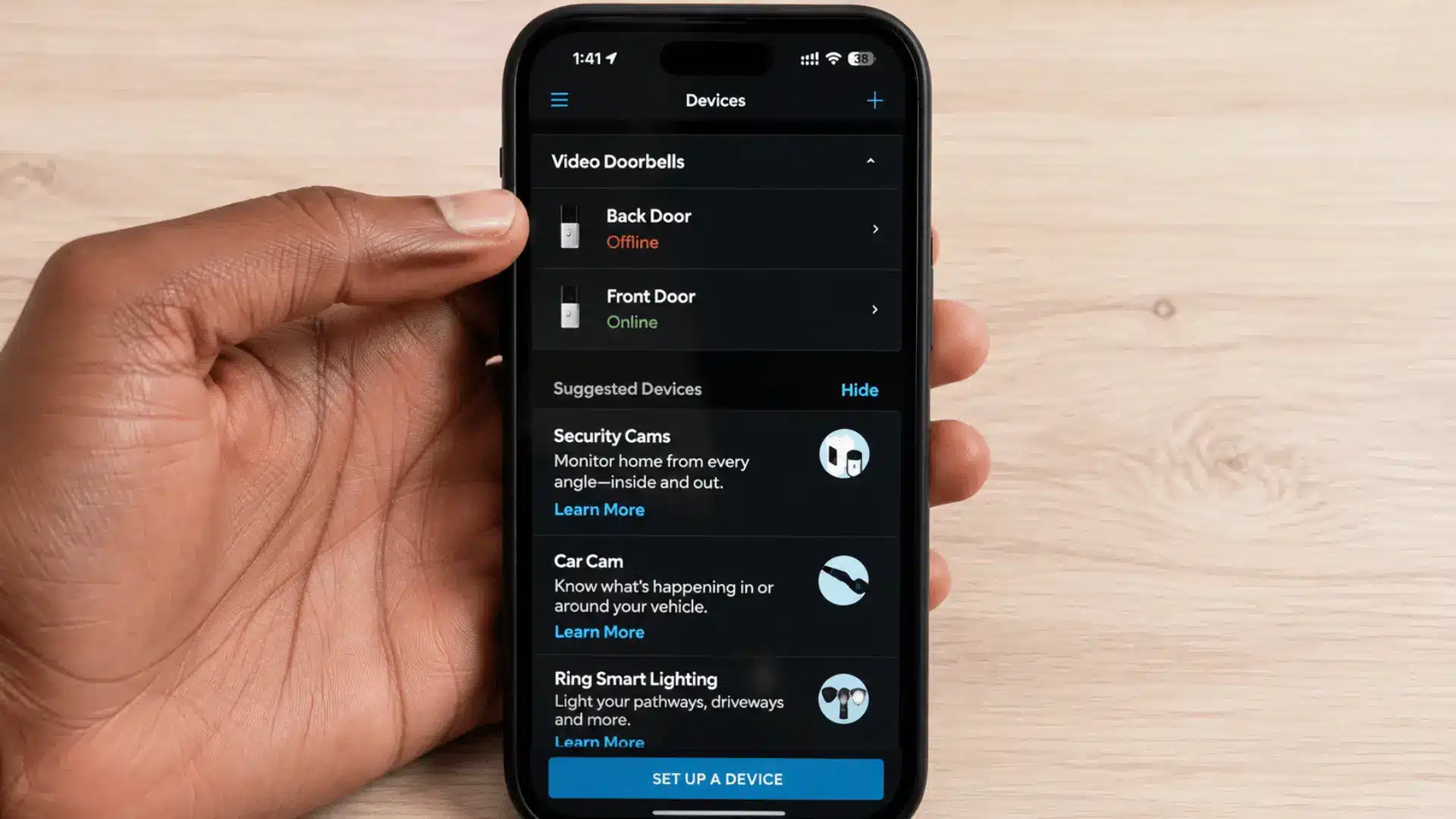 Ring app Devices screen showing an offline doorbell and available devices for Wi-Fi reconnection setup.