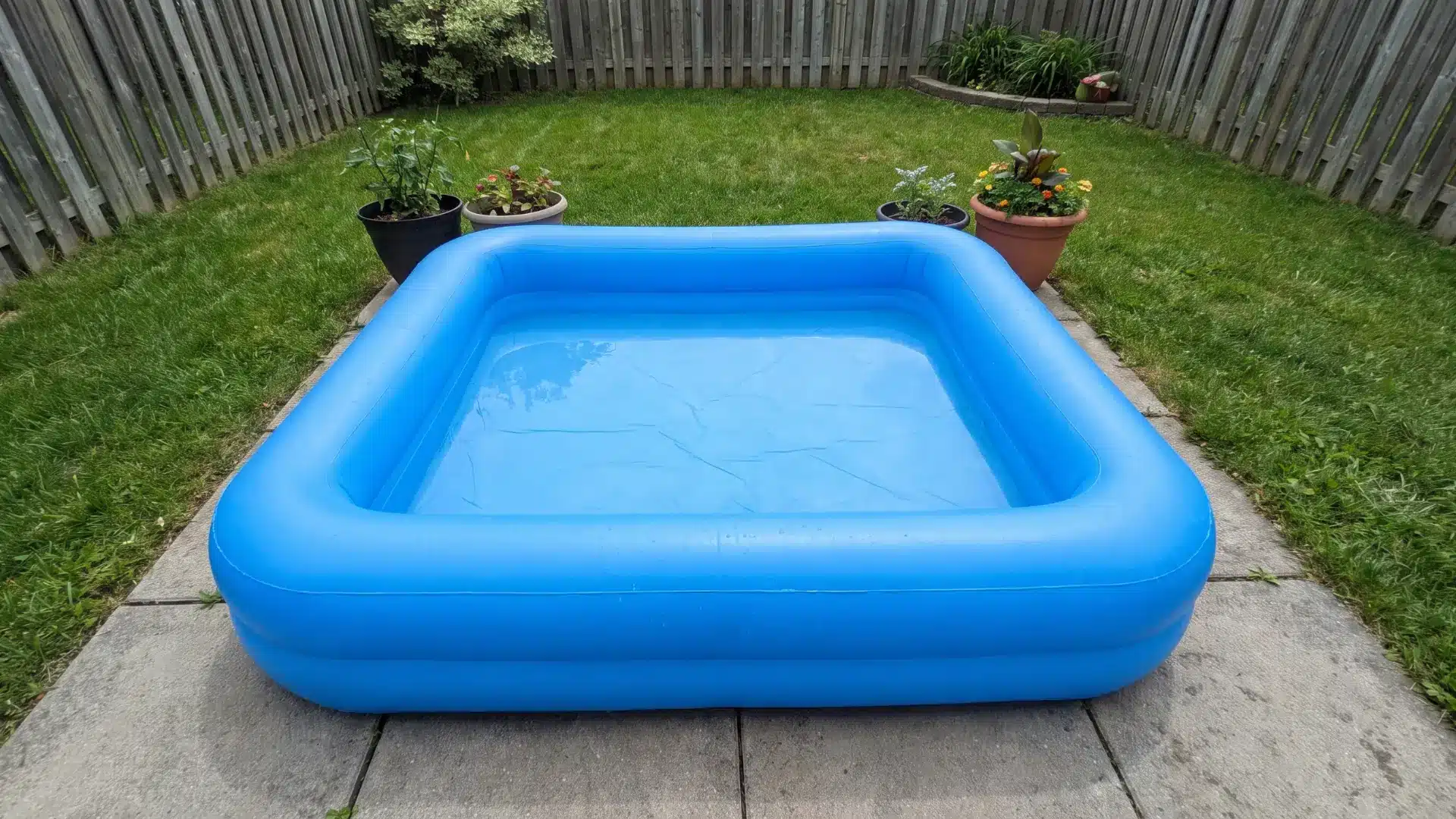 Shallow splash pool in a small backyard