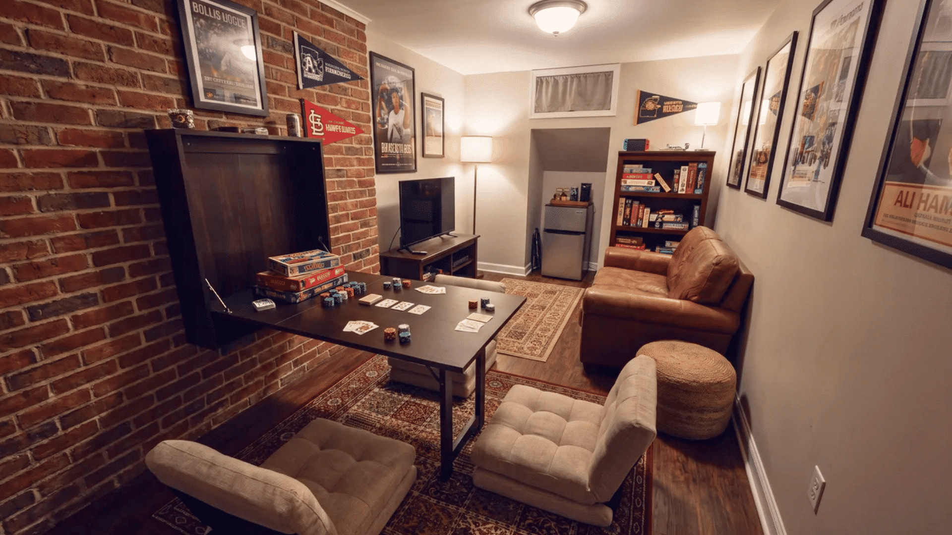 Small man cave with a fold-down card table extended from one wall and compact floor seating nearby