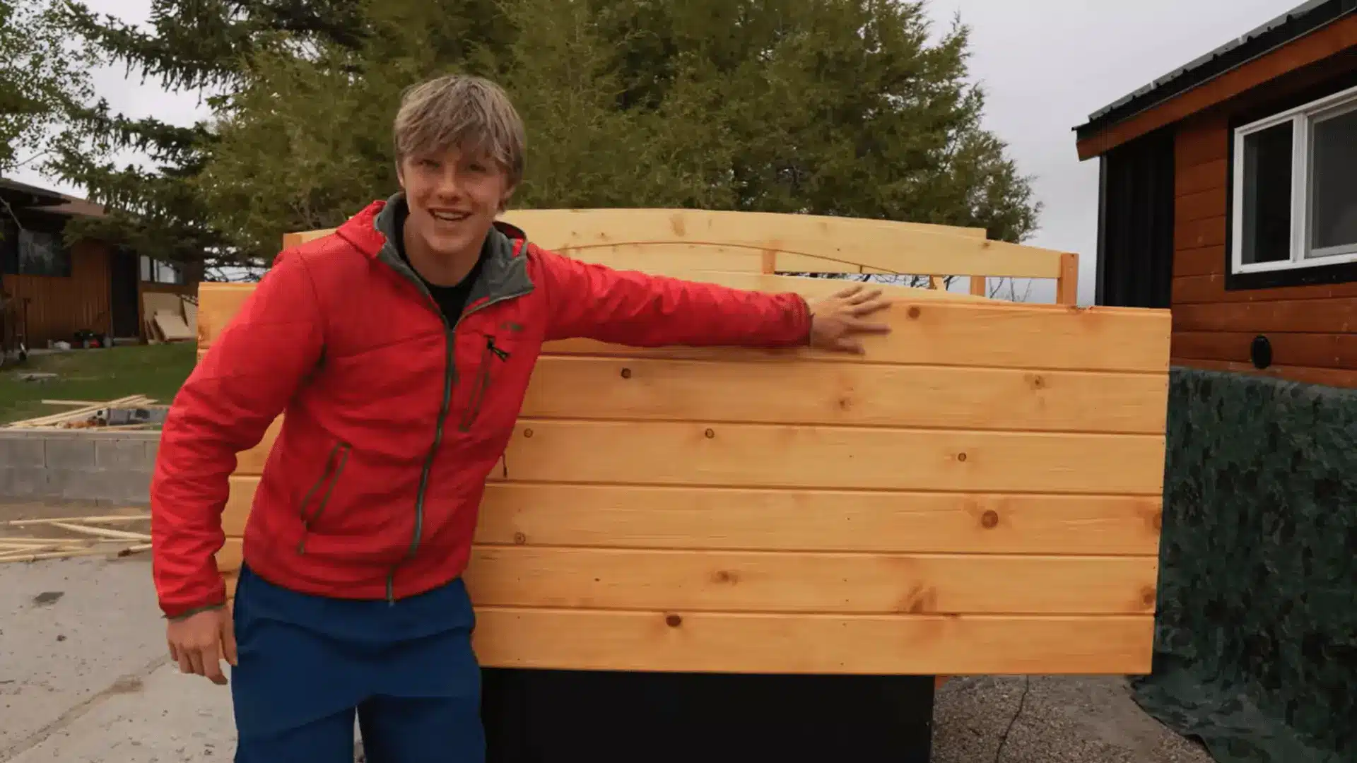 Tongue-and-groove siding boards installed on the wooden truck camper exterior.