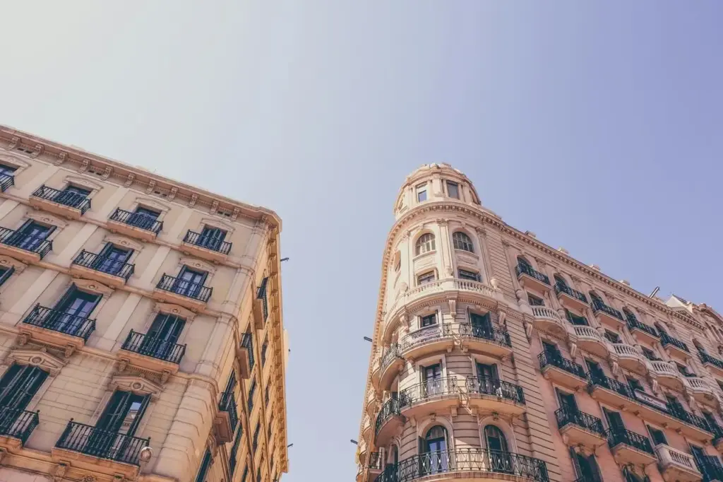Ornate historic buildings with balconies against a clear blue sky
