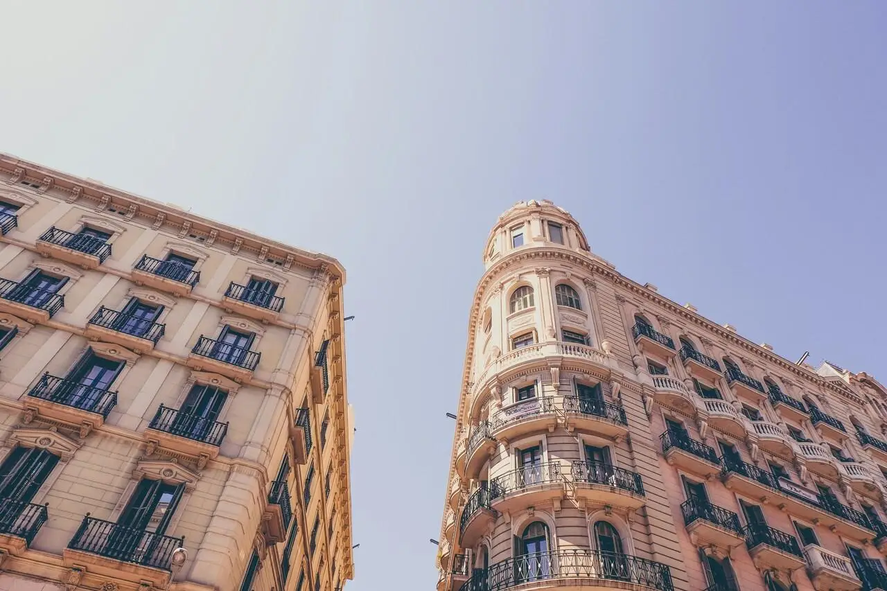 Ornate historic buildings with balconies against a clear blue sky