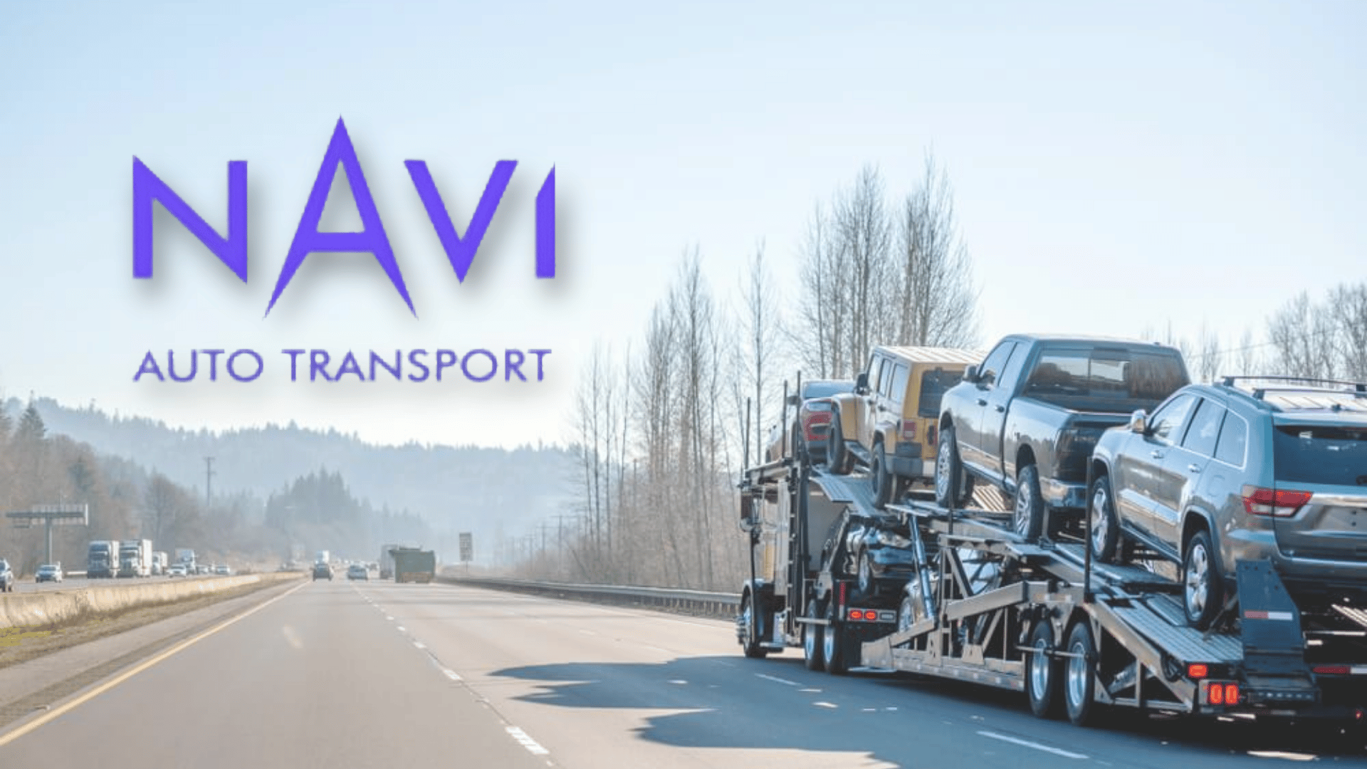 navi auto transport logo with vehicles loaded on a car carrier truck on an open highway road